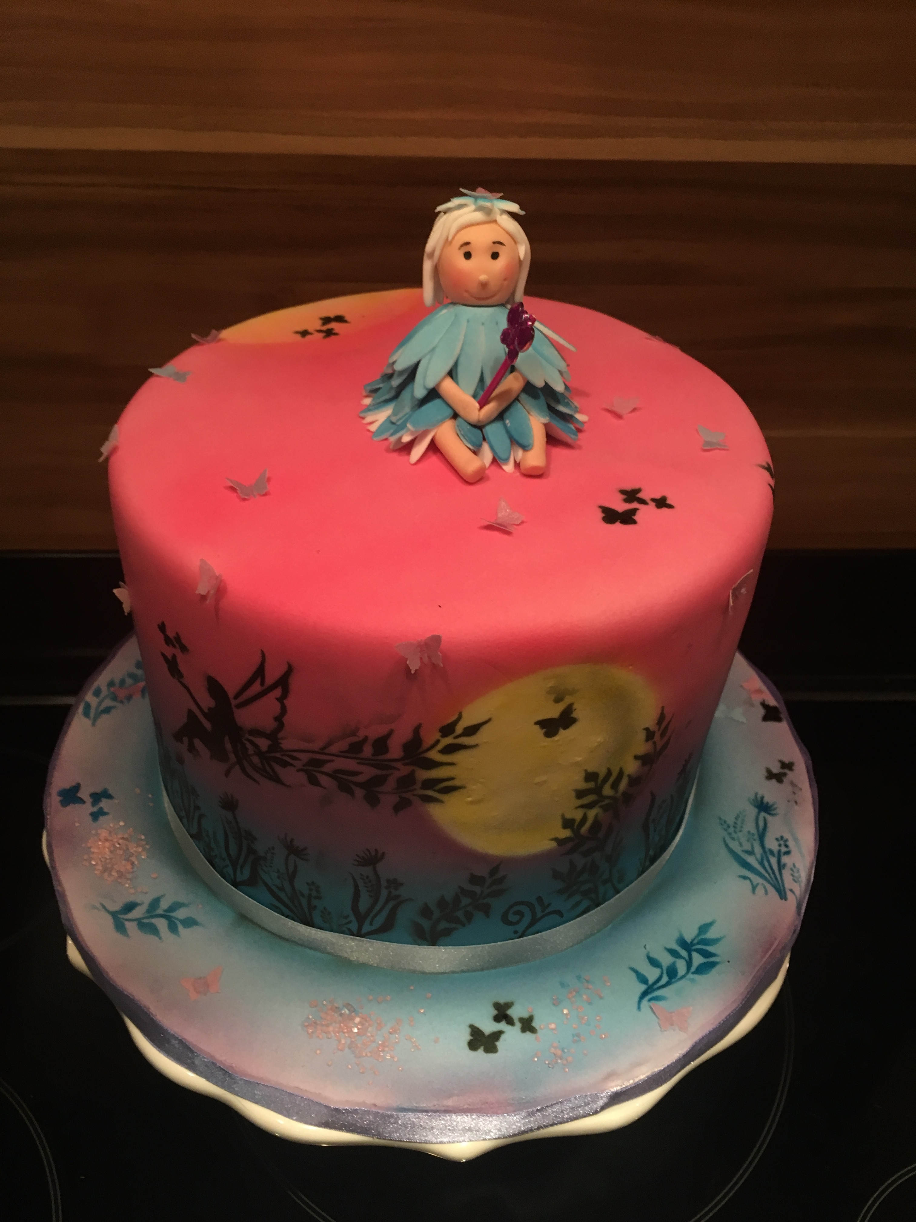 Airbrushed triple tiered fairy themed cake
